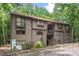 Neutral brown condos showcase a wooded setting, offering a serene and private living environment at 3086 Colony Rd # C, Durham, NC 27705