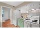 Galley kitchen with white appliances and laminate countertops at 3086 Colony Rd # C, Durham, NC 27705