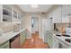 Galley kitchen featuring tile backsplash and laminate countertops at 3086 Colony Rd # C, Durham, NC 27705