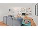 A well-lit living room offers a cozy fireplace, decorative shelving, and comfortable seating arrangement at 3086 Colony Rd # C, Durham, NC 27705