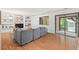 Inviting living room with built-in bookshelves, a cozy fireplace, and sliding door to the outdoors at 3086 Colony Rd # C, Durham, NC 27705