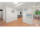 Bright condo entryway leads to a spacious living room and dining area with wood-look floors at 3086 Colony Rd # C, Durham, NC 27705