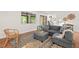 Comfortable condo living room features a cozy seating arrangement and sliding door to the outdoors at 3086 Colony Rd # C, Durham, NC 27705