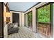Bright sunroom with tile flooring and sliding doors to the outdoors at 3086 Colony Rd # C, Durham, NC 27705