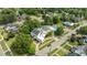 Aerial view of a charming neighborhood with mature trees, manicured lawns, and a community pool at 309 W Divine St, Dunn, NC 28334
