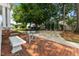 Backyard brick patio area with garden furniture and a gazebo at 309 W Divine St, Dunn, NC 28334