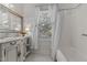 Well-lit bathroom with natural light, vanity, and a shower/tub combo at 309 W Divine St, Dunn, NC 28334