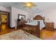 Bedroom with hardwood floors, a ceiling fan and a full dresser at 309 W Divine St, Dunn, NC 28334