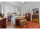 Charming bedroom features hardwood floors, a decorative rug, and ample storage space at 309 W Divine St, Dunn, NC 28334