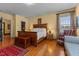 Spacious bedroom features a decorative rug and a large wooden bed frame with side tables at 309 W Divine St, Dunn, NC 28334