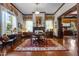 Dining room featuring wood trim, a decorative fireplace, and a table with seating for four at 309 W Divine St, Dunn, NC 28334