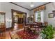 Dining room featuring wood trim, a round table, and a view into the adjacent rooms at 309 W Divine St, Dunn, NC 28334