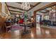 Elegant foyer with hardwood floors, wood paneled walls, crystal chandeliers, and a grand staircase at 309 W Divine St, Dunn, NC 28334