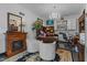 Cozy home office with fireplace, wood desk, chandelier, and built-in storage at 309 W Divine St, Dunn, NC 28334