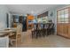 Eat-in kitchen boasts stainless steel appliances, breakfast bar, and access to the outdoors at 309 W Divine St, Dunn, NC 28334