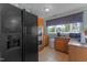 Well-equipped kitchen boasts stainless steel appliances, oak cabinets, and natural light at 309 W Divine St, Dunn, NC 28334