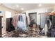 Spacious laundry room with unique marble flooring and commercial grade laundry equipment at 309 W Divine St, Dunn, NC 28334