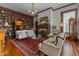 Elegant living room boasts a fireplace, hardwood floors, and built-in bookshelves at 309 W Divine St, Dunn, NC 28334