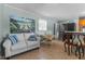Bright living room adjacent to the kitchen features a comfortable sofa and dining area at 309 W Divine St, Dunn, NC 28334