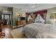 Main bedroom featuring light green walls, a ceiling fan and stylish decor with a view at 309 W Divine St, Dunn, NC 28334