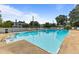Inviting community pool surrounded by lounge chairs and a well-maintained white picket fence at 309 W Divine St, Dunn, NC 28334