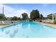 Community pool area featuring lounge chairs, white fencing, and a gazebo at 309 W Divine St, Dunn, NC 28334