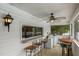Screened porch with bar seating, ceiling fan, and convenient washer and dryer hookups at 309 W Divine St, Dunn, NC 28334
