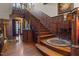 Elegant wood staircase with ornate details and a grand, welcoming ambiance at 309 W Divine St, Dunn, NC 28334
