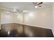 Spacious basement with hardwood floors, track lighting, and a mirrored wall at 315 Allister Dr, Raleigh, NC 27609