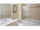Bathroom with a tiled shower over tub, a framed print, and a single vanity at 315 Allister Dr, Raleigh, NC 27609