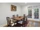Cozy dining room with hardwood floors, access to an outdoor patio, and traditional decor at 315 Allister Dr, Raleigh, NC 27609