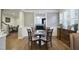 Formal dining room featuring hardwood floors, a pass through to the kitchen, and room to seat four at 315 Allister Dr, Raleigh, NC 27609