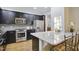 Modern kitchen with stainless steel appliances, granite countertops, and a breakfast bar with seating at 315 Allister Dr, Raleigh, NC 27609