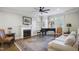 Elegant living room with fireplace, large windows with shutters, hardwood floors, and stylish furnishings at 315 Allister Dr, Raleigh, NC 27609