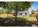 Spacious backyard with mature trees offering plenty of shade and privacy at 317 Striped Maple Ct, Apex, NC 27539
