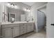 This bathroom features a double vanity, tile flooring, and neutral paint at 317 Striped Maple Ct, Apex, NC 27539