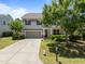 Charming two-story home with a well-manicured front yard and long driveway at 317 Striped Maple Ct, Apex, NC 27539