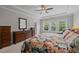 Comfortable main bedroom with large windows and an ample amount of storage space at 317 Striped Maple Ct, Apex, NC 27539