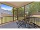 Comfortable screened porch with a table and chairs perfect for relaxing at 317 Striped Maple Ct, Apex, NC 27539