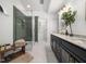 Spa-like bathroom with a glass-enclosed shower and double vanity at 3400 Appling Way, Durham, NC 27703