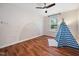 Neutral bedroom featuring hardwood floors and a playful wall mural, creating a serene atmosphere at 3400 Appling Way, Durham, NC 27703