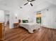 Spacious main bedroom featuring wood floors, natural lighting and a ceiling fan at 3400 Appling Way, Durham, NC 27703