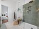 Modern shower with glass enclosure, a tiled surround, and rainfall shower head at 3400 Appling Way, Durham, NC 27703