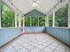 Cozy screened-in porch with a vaulted ceiling, wood floor, and backyard views at 3400 Appling Way, Durham, NC 27703