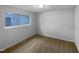 This bedroom features neutral carpet, a window, and fresh paint at 3721 Suffolk St, Durham, NC 27707