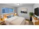 Cozy bedroom with a soft rug, stylish nightstands and lamps for a relaxing ambiance at 3721 Suffolk St, Durham, NC 27707