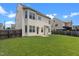 Grassy backyard featuring a patio and wood privacy fence at 40 Horizon Trl, Garner, NC 27529