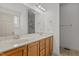 Bathroom with a double sink vanity, large mirror, and modern light fixtures at 40 Horizon Trl, Garner, NC 27529