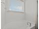 Bright bathroom with a soaking tub and a window for natural light at 40 Horizon Trl, Garner, NC 27529