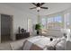 Cozy bedroom with ceiling fan, large window, and stylish furnishings; inviting and well-decorated at 40 Horizon Trl, Garner, NC 27529